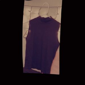 A turtle neck crop tank top